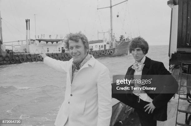 Disc jockeys Robbie Dale and Johnnie Walker of offshore pirate radio 'Radio Caroline' arrive at Felixstowe, UK, 15th August 1967.