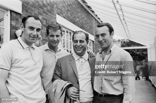 Italian football agent Gigi Peronace with Tottenham Hotspur FC players Alan Glzean, Jimmy Greaves, and Alan Mullery, UK, 31st July 1967.