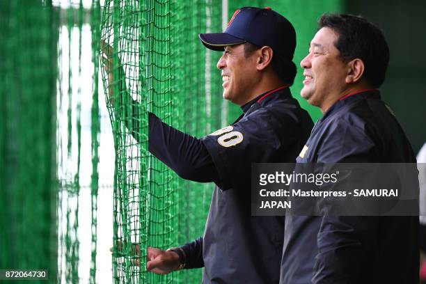 Tsutomu Ito and Atsunori Inaba of Samurai Japan smiles during a Japan training session on November 9, 2017 in Miyazaki, Japan.