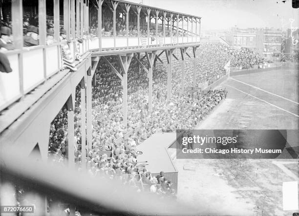 View from the West Side Grounds upper deck of spectators in the crowded grandstands, Chicago, Illinois, 1908. The game pitted the Chicago Cubs...