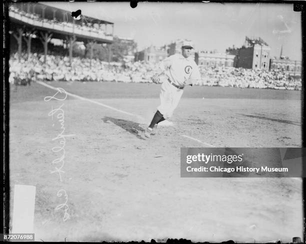Baseball player Harry Steinfeldt , of the Chicago Cubs, rounds third base during a game at West Side Grounds, Chicago, Illinois, 1908.