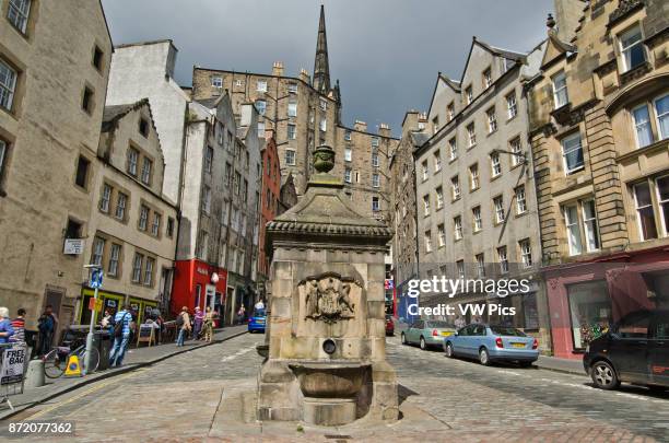 The junction between the Grassmarket and Victoria street in Edinburgh's Old Town. In the foreground is Bow Well.