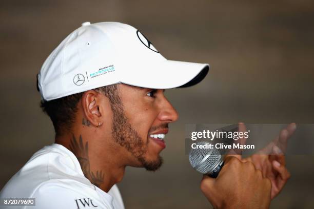 Lewis Hamilton of Great Britain and Mercedes GP talks to the media during previews for the Formula One Grand Prix of Brazil at Autodromo Jose Carlos...