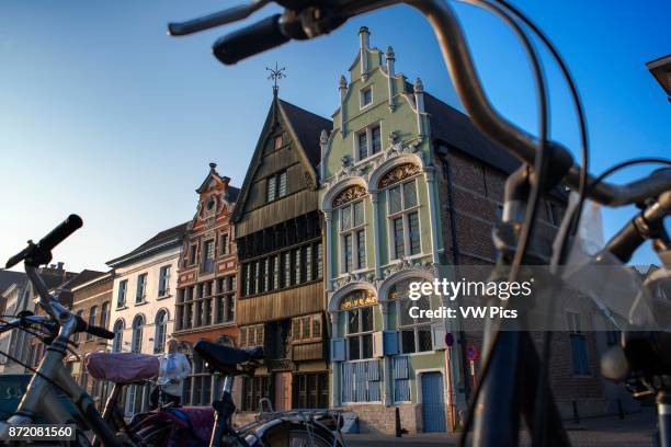 Buildings and houses along the canal channel waterway boat in Mechelen at sunset, Flanders, Belgium.