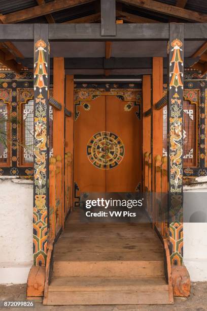 Architectural detail of Buddhist art on a door in the Punakha Dzong. Punakha, Bhutan.