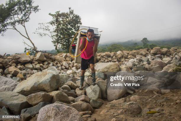 Man loads objects from his house after the avalanche of last 01 April which affected to 17 neighbourhoods in Mocoa, Colombia, 04 April 2017.