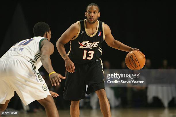 Tony Bethel of the Erie Bayhawks dribbles against Russell Robinson of the Reno Bighorns during the D-League game at the Reno Events Center on April...