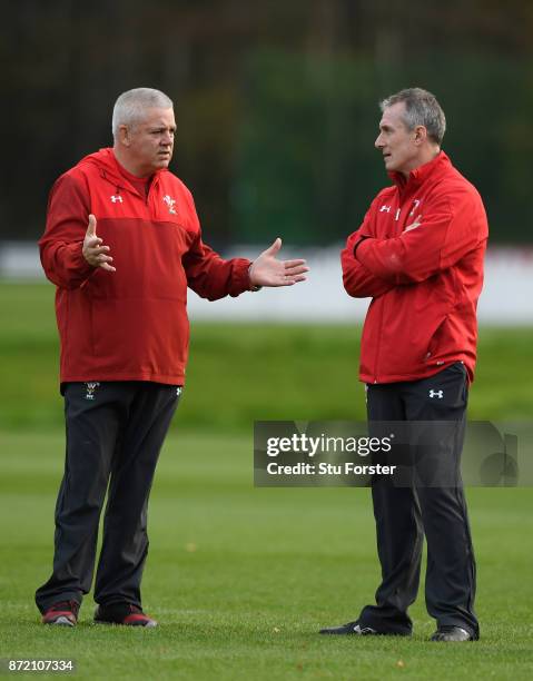 Wales Head coach Warren Gatland chats with assistant Robert Howley during Wales Media access ahead of their game against the Australian Wallabies at...