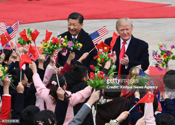 Nov. 9, 2017 -- Chinese President Xi Jinping holds a grand ceremony to welcome U.S. President Donald Trump at the square outside the east gate of the...