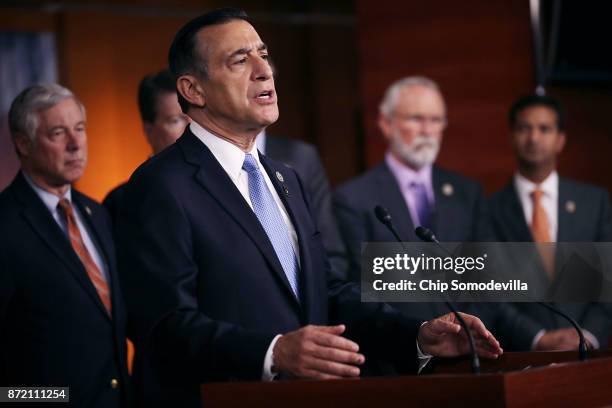 Rep. Darryll Issa is joined by more than a dozen Republican members of Congress as he speaks during a news conference about the Deferred Action for...