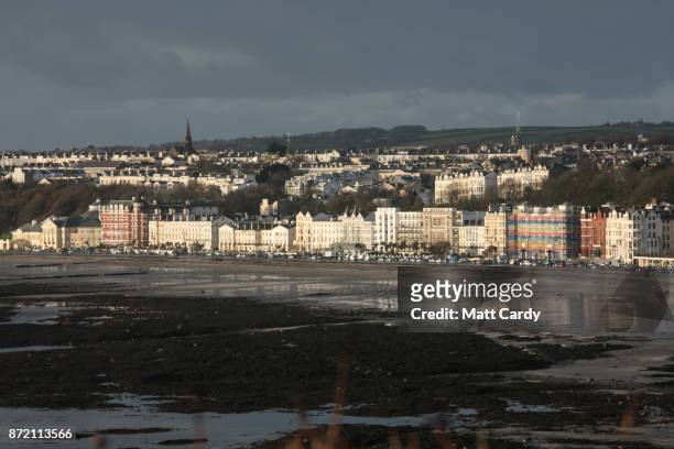 The early morning sun illuminates buildings in the town of Douglas on November 9, 2017 in Douglas, Isle of Man. The Isle of Man is a low-tax British...