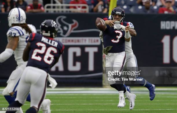 Tom Savage of the Houston Texans throws an incomplete pass under pressure applied by Jon Bostic of the Indianapolis Colts in the first quarter at NRG...