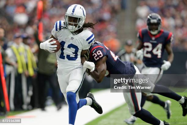 Hilton of the Indianapolis Colts is forced out of bounds by Andre Hal of the Houston Texans in the second quarter at NRG Stadium on November 5, 2017...