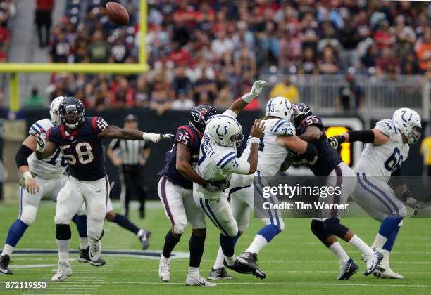 Eddie Pleasant of the Houston Texans sacks Jacoby Brissett of the Indianapolis Colts forcing a second quarter fumble at NRG Stadium on November 5,...