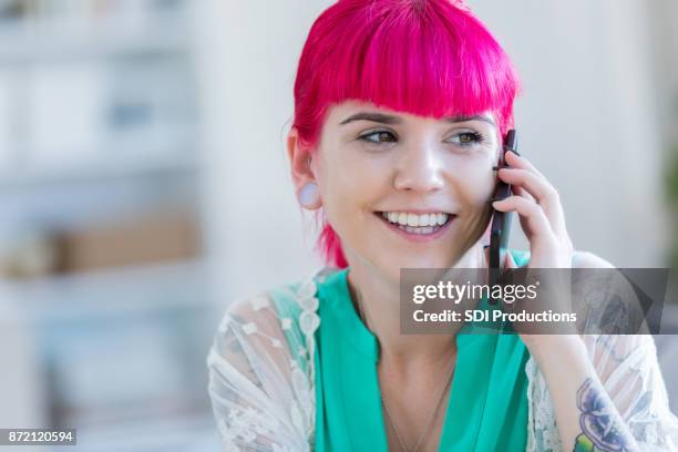 closeup of artistic young woman talking on phone - happiness meter stock pictures, royalty-free photos & images