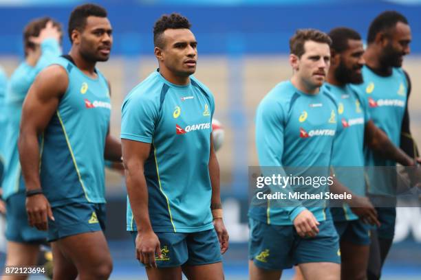 Allan Alaalat , Will Genia and Bernard Foley during the Australia training session at Cardiff Arms Park on November 9, 2017 in Cardiff, Wales.