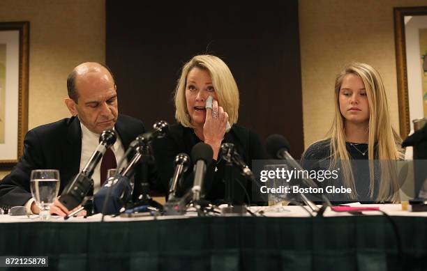 Former Boston news anchor Heather Unruh, center, holds a press conference in Boston on Nov. 8, 2017 to discuss the alleged sexual abuse of her son by...