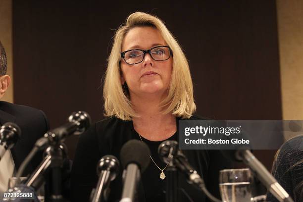 Former Boston news anchor Heather Unruh, center, holds a press conference in Boston on Nov. 8, 2017 to discuss the alleged sexual abuse of her son by...