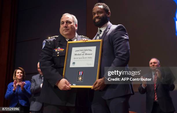 Capitol Police Chief Matthew Verderosa presents US Capitol Police Special Agent David Bailey with the US Capitol Police Medal of Honor for his...