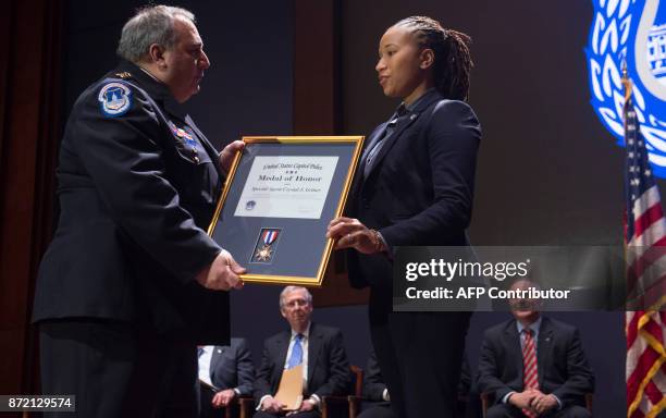 Capitol Police Chief Matthew Verderosa presents US Capitol Police Special Agent Crystal Griner with the US Capitol Police Medal of Honor for her...