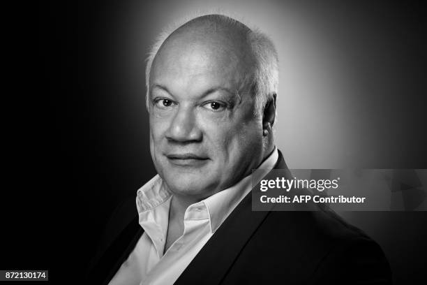 French-Belgian writer Eric-Emmanuel Schmitt poses during a photo session in Paris on November 03, 2017. / AFP PHOTO / JOEL SAGET / BLACK AND WHITE...