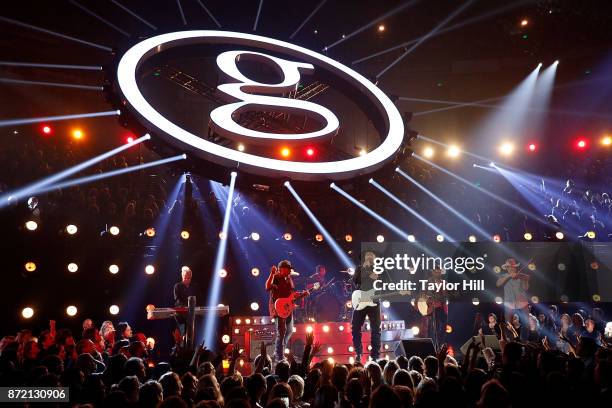 Garth Brooks and Mitch Rossell perform during the 51st annual CMA Awards at the Bridgestone Arena on November 8, 2017 in Nashville, Tennessee.