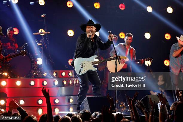 Garth Brooks and Mitch Rossell perform during the 51st annual CMA Awards at the Bridgestone Arena on November 8, 2017 in Nashville, Tennessee.
