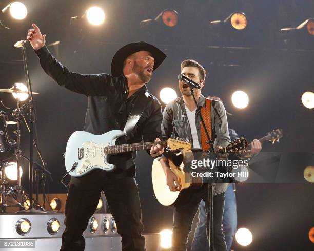 Garth Brooks and Mitch Rossell perform during the 51st annual CMA Awards at the Bridgestone Arena on November 8, 2017 in Nashville, Tennessee.