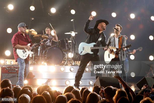 Garth Brooks and Mitch Rossell perform during the 51st annual CMA Awards at the Bridgestone Arena on November 8, 2017 in Nashville, Tennessee.