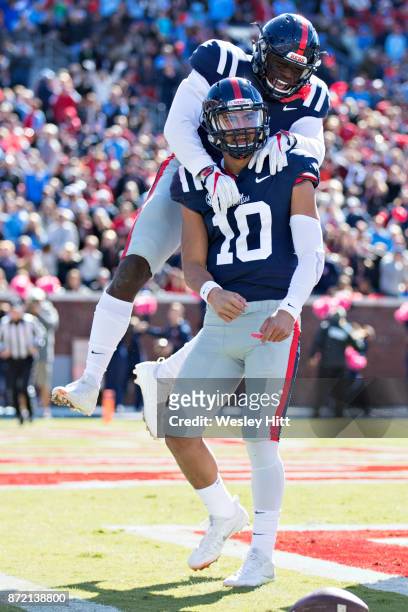 Jordan Ta'amu and A.J. Brown of the Ole Miss Rebels celebrate after scoring a touchdown during a game against the Arkansas Razorbacks at Hemingway...