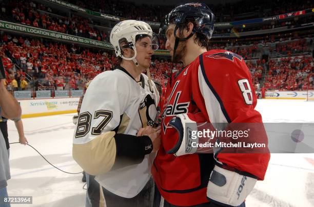 Alex Ovechkin of the Washington Capitals and Sidney Crosby of the Pittsburgh Penguins shake hands at the end of the game at the Verizon Center during...