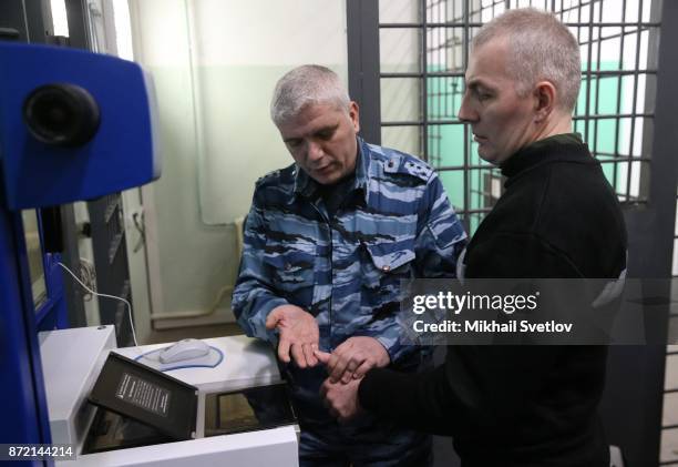 An imprisoned man has his fingerprints taken in the SIZO 2, also known as Butyrka prison on October 31, 2017 in Moscow, Russia. Butyrka prison, or...