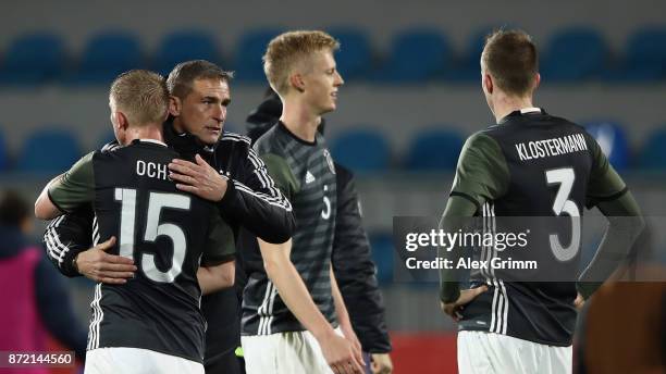 Head coach Stefan Kuntz of Germany hugs Philipp Ochs after the UEFA Under21 Euro 2019 Qualifier match between Azerbaijan U21 and Germany U21 at Dalga...