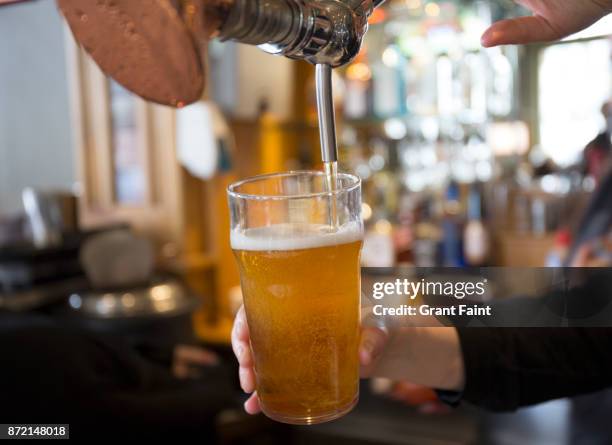 beer being served in sydney pub. - juicer stock pictures, royalty-free photos & images