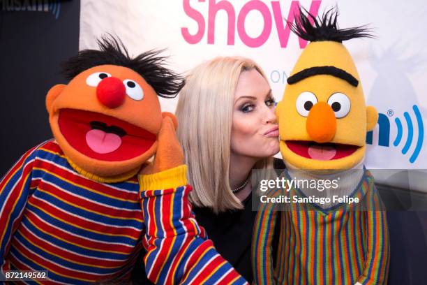 Jenny McCarthy poses for photos with Bert and Ernie at SiriusXM Studios on November 9, 2017 in New York City.