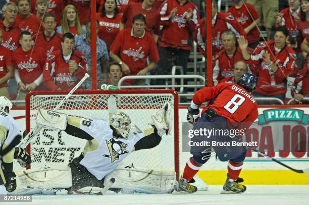 Alex Ovechkin of the Washington Capitals is stopped by Marc-Andre Fleury of the Pittsburgh Penguins during first period action in Game Seven of the...