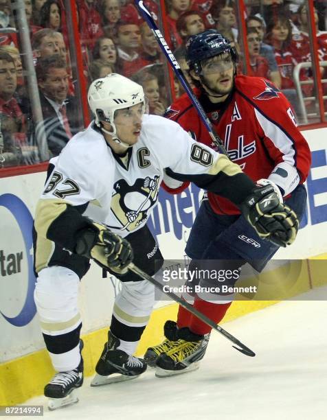 Alex Ovechkin of the Washington Capitals skates against Sidney Crosby of the Pittsburgh Penguins during Game Seven of the Eastern Conference...