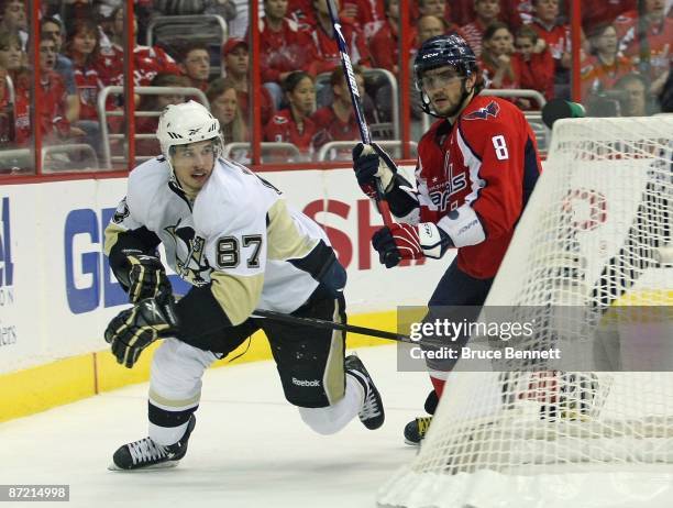 Alex Ovechkin of the Washington Capitals skates against Sidney Crosby of the Pittsburgh Penguins during Game Seven of the Eastern Conference...