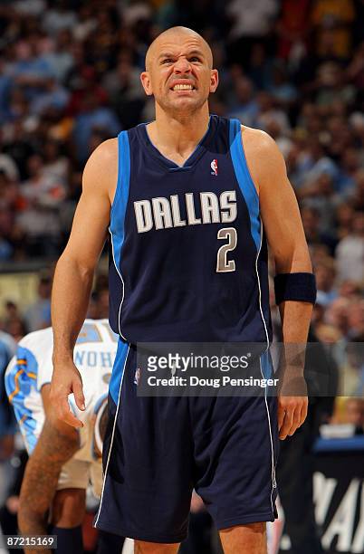 Jason Kidd of the Dallas Mavericks grimaces after a fall while fouling against the Denver Nuggets in Game Five of the Western Conference Semifinals...