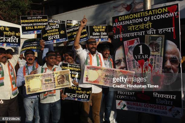 Congress workers protest against one year completion of Demonetisation and BJP Govt, outside Mulund Railway Station, on November 7, 2017 in Mumbai,...
