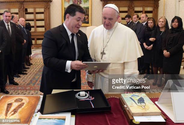 Pope Francis exchanges gifts with President of Paraguay Horacio Manuel Cartes Jara during an audience at the Apostolic Palace on November 9, 2017 in...