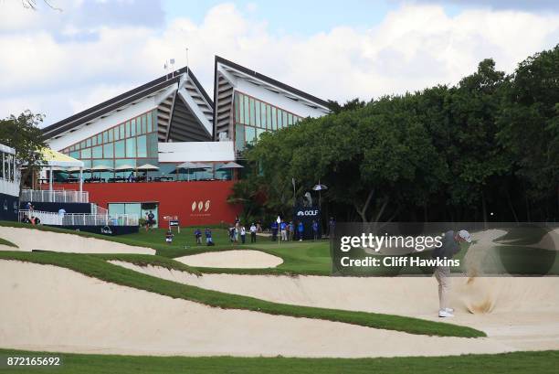 Patton Kizzire of the United States plays a shot from a bunker on the 18th hole during the first round of the OHL Classic at Mayakoba on November 9,...