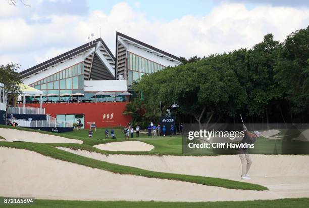 Patton Kizzire of the United States plays a shot from a bunker on the 18th hole during the first round of the OHL Classic at Mayakoba on November 9,...