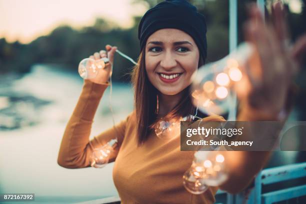 light bulbs and beautiful smile - edison light bulb stock pictures, royalty-free photos & images