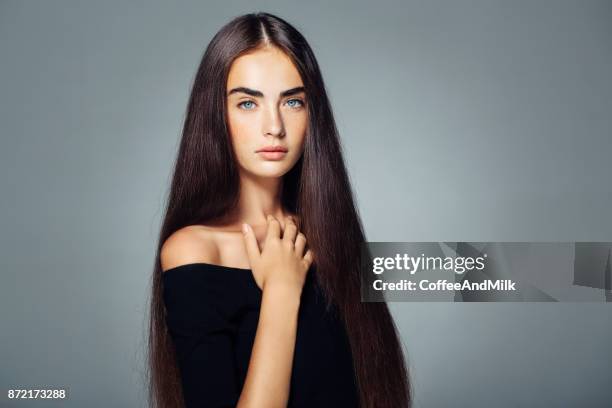 studio shot of young beautiful woman - straight hair stock pictures, royalty-free photos & images