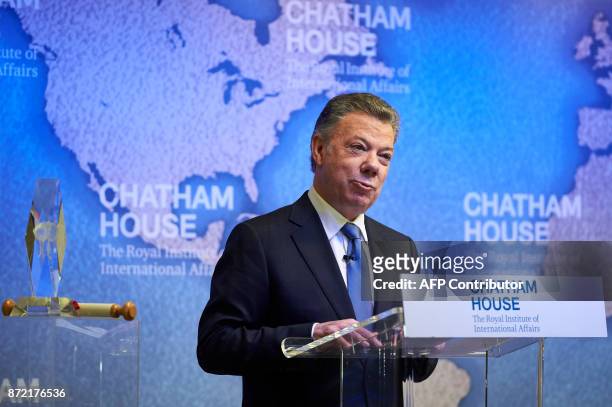 Colombia's President Juan Manuel Santos gives a speech after receiving the annual Chatham House Prize from Britain's Prince Andrew, Duke of York at...