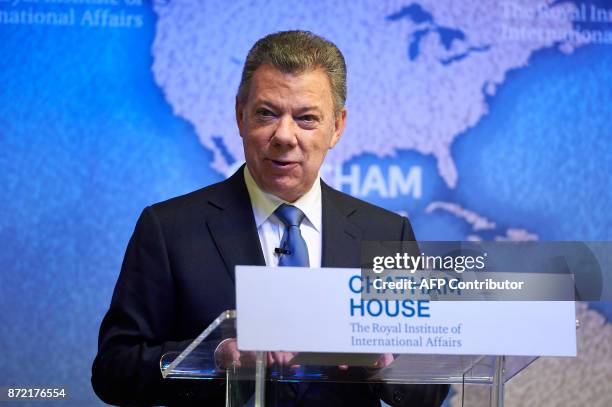 Colombia's President Juan Manuel Santos gives a speech after receiving the annual Chatham House Prize from Britain's Prince Andrew, Duke of York at...