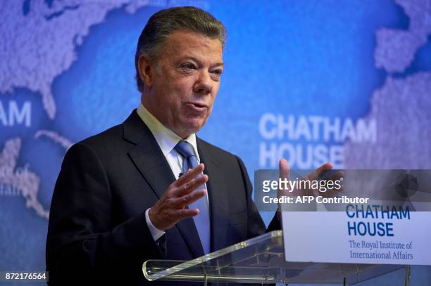 Colombia's President Juan Manuel Santos gives a speech after receiving the annual Chatham House Prize from Britain's Prince Andrew, Duke of York at...