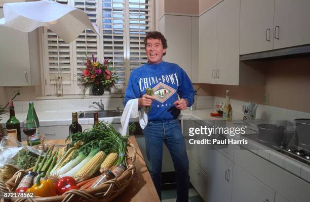 Michael Crawford in his Hollywood apartment preparing food in the kitchen August 9, 1991 Hollywood, Los Angeles, California