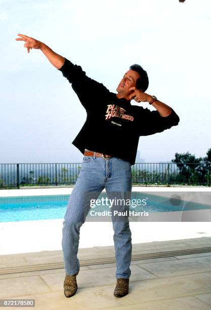 May 16, 1991. Sylvester Stallone beside the pool in his Beverly Hills home celebrating the opening of the chain of restaurants called Planet...